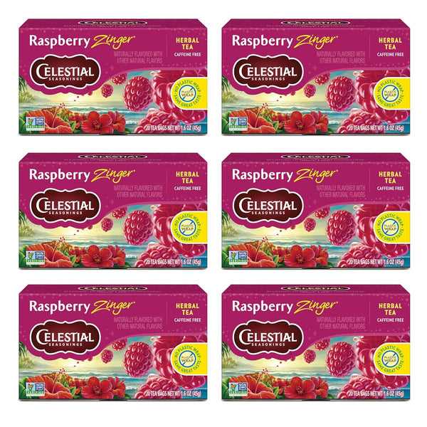 Six boxes of Celestial Seasonings Raspberry Zinger Herbal Tea on a white background