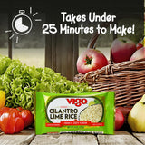 Vigo Cilantro Lime Rice package with fresh vegetables and a basket of apples on a wooden surface.