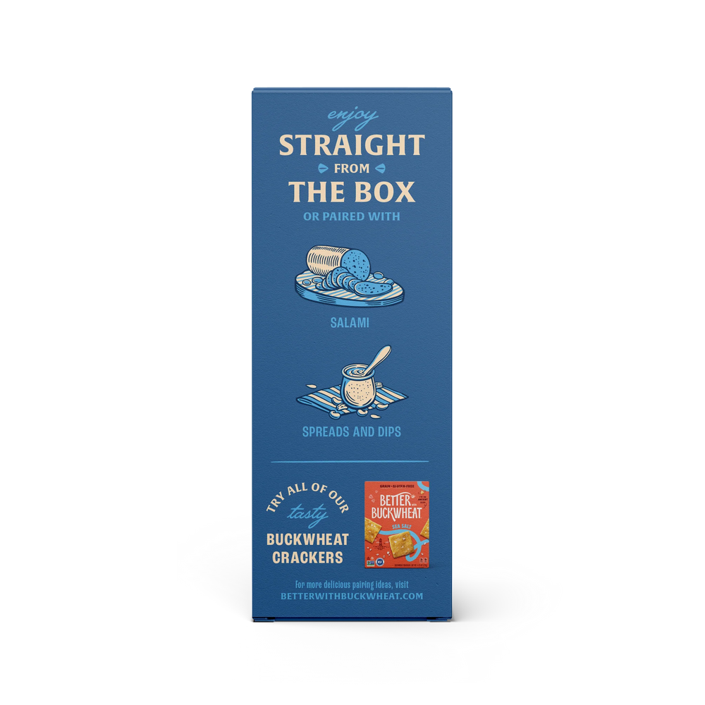 Blue box of buckwheat crackers with text and a smaller red box on a white background