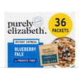 Box of purely elizabeth Blueberry Flax instant oatmeal with a bowl of oatmeal and blueberries on a white background.