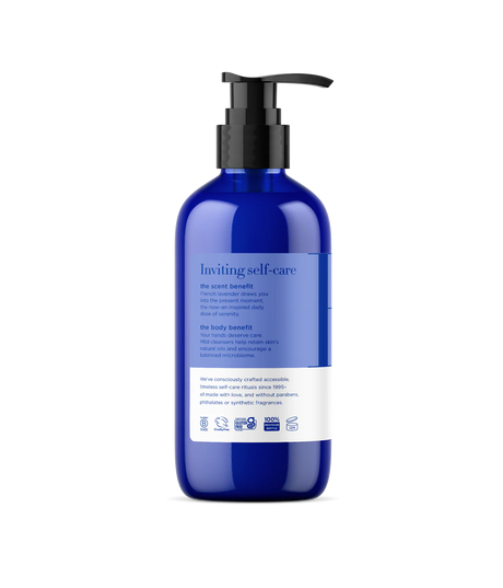 Blue bottle with pump dispenser on a white background