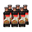 Six bottles of Kame Oyster Sauce on a white background