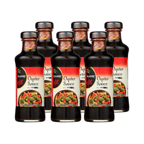 Six bottles of Kame Oyster Sauce on a white background