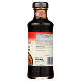 Bottle of soy sauce with label on a white background