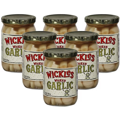 Six jars of Wickles Wicked Garlic on a white background