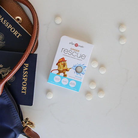 Ginger Rescue packaging with travel accessories on a light surface