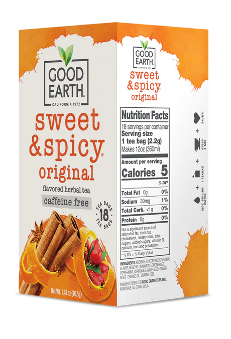 Good Earth Sweet & Spicy tea box with cinnamon sticks and red peppers on a white background