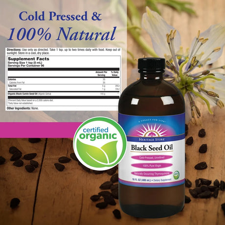 Heritage Store Black Seed Oil bottle with supplement facts label on a wooden surface.
