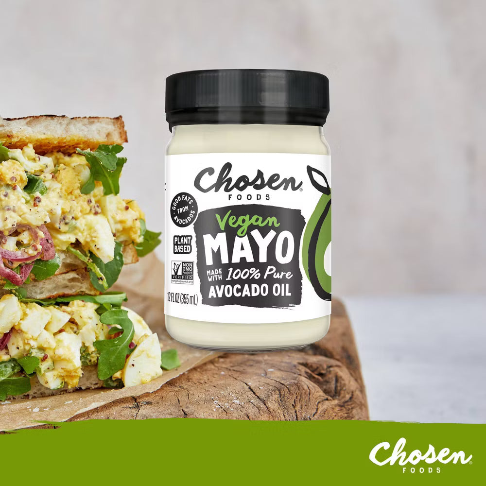 Jar of Chosen Foods Vegan Mayo with a sandwich in the background