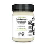 Jar of plant-based spread with a black lid on a white background