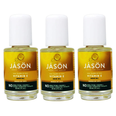 Three bottles of Jason Vitamin E Skin Oil on a white background