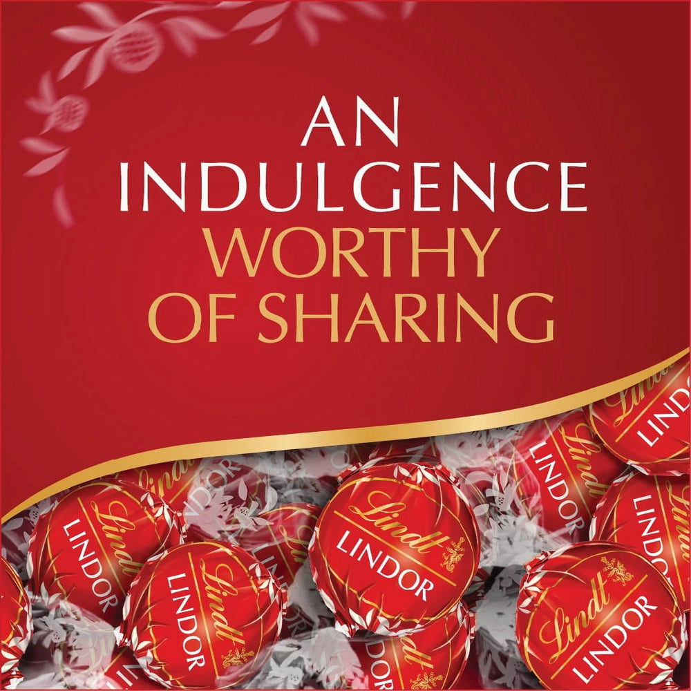 Lindor chocolate truffles in red packaging with 'An Indulgence Worthy of Sharing' text.