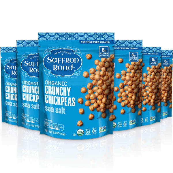 Multiple packages of Saffron Road Organic Crunchy Chickpeas sea salt on a white background