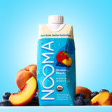 NOOMA Blueberry Peach sports drink bottle with fruits on a blue background
