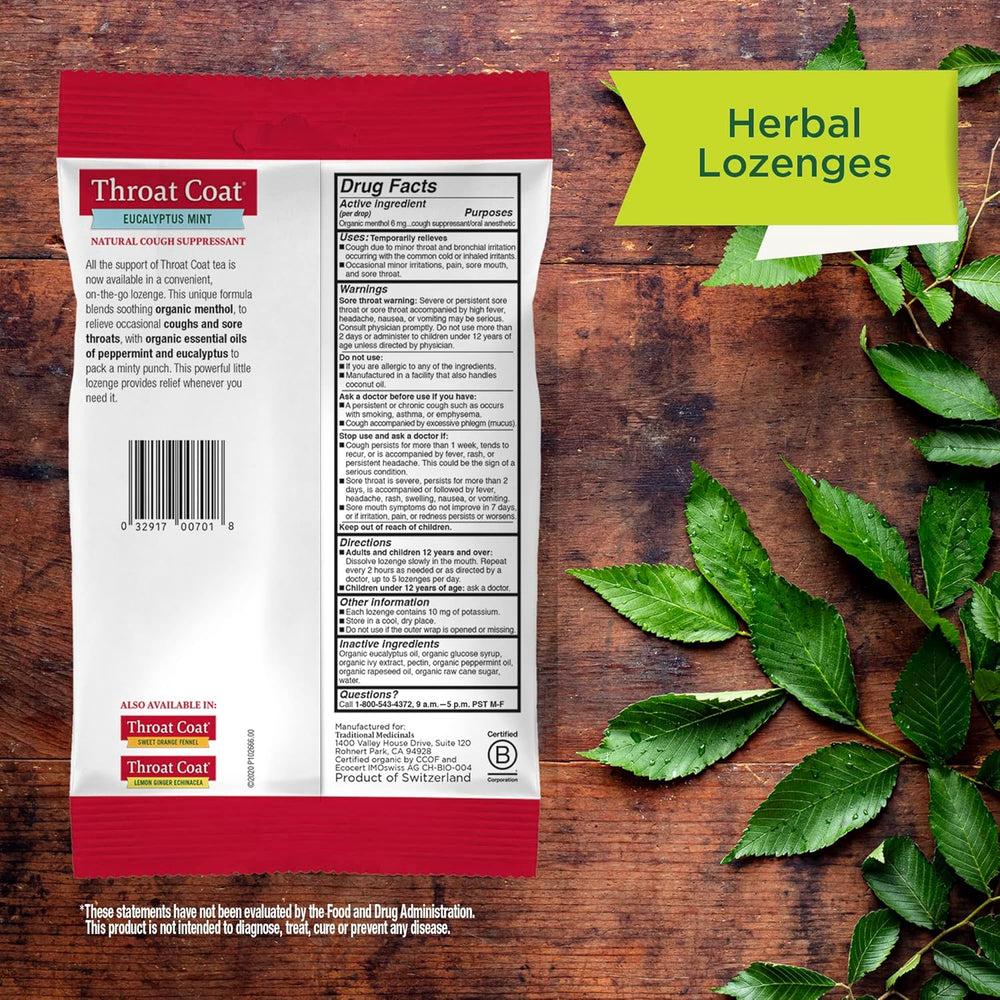 Throat coat lozenge package with green leaves on a wooden background