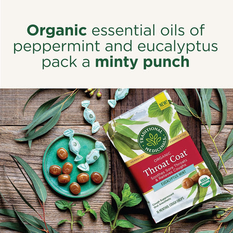 Traditional Medicinals Organic Throat Coat package with peppermint and eucalyptus on a wooden surface