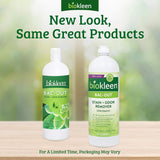 Two bottles of Biokleen Bac-Out stain and odor remover on a wooden surface with a blurred green background.