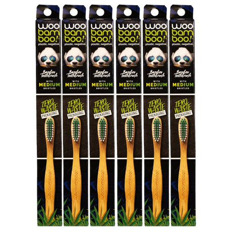 Packaging of bamboo toothbrushes with visible branding and product details.