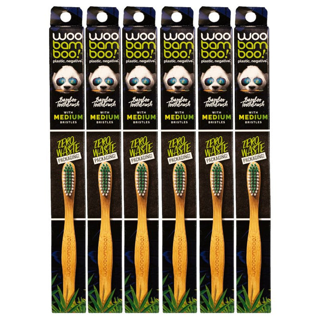 Packaging of bamboo toothbrushes with visible branding and product details.