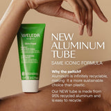 Weleda Skin Food tube with text about new aluminum packaging on a beige background