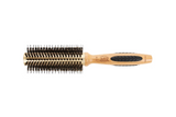 Hairbrush with wooden handle and black bristles on a white background