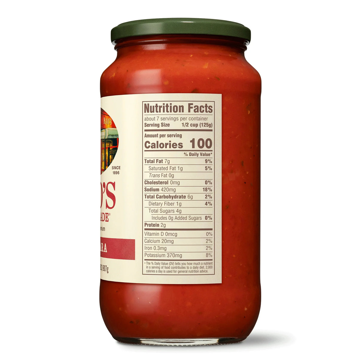 Jar of spaghetti sauce with a nutrition facts label on a white background