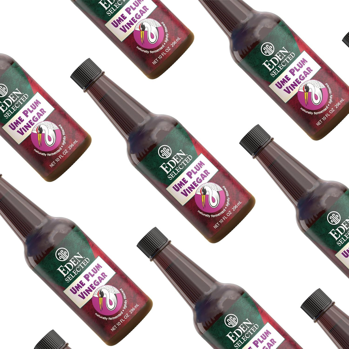 Multiple bottles of Eden Selected Ume Plum Vinegar arranged in a pattern on a white background.