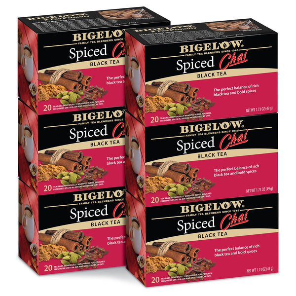 Multiple boxes of Bigelow Spiced Chai Black Tea on a white background
